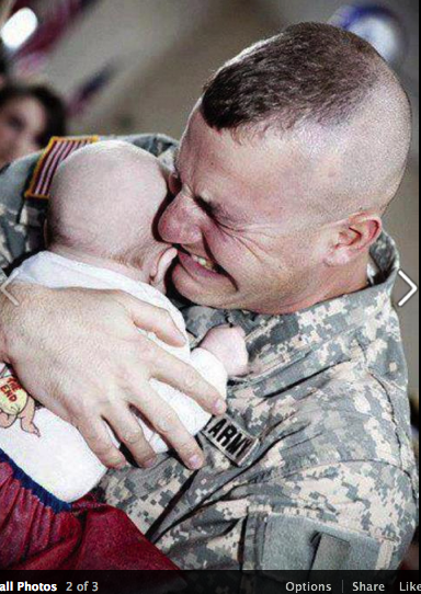 Army soldier moment of awe with baby